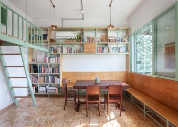 Không gian nội thất Tempo Nexus Library với gạch bông cũ được phục hồi, kệ gỗ và ánh sáng tự nhiên trong chung cư Lê Ngọc, 130 Pasteur TP.HCM - 9