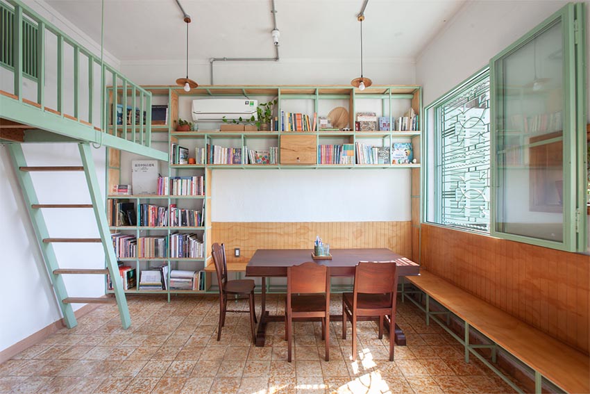 Không gian nội thất Tempo Nexus Library với gạch bông cũ được phục hồi, kệ gỗ và ánh sáng tự nhiên trong chung cư Lê Ngọc, 130 Pasteur TP.HCM - 9