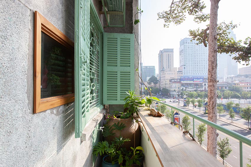 Không gian nội thất Tempo Nexus Library với gạch bông cũ được phục hồi, kệ gỗ và ánh sáng tự nhiên trong chung cư Lê Ngọc, 130 Pasteur TP.HCM - 5